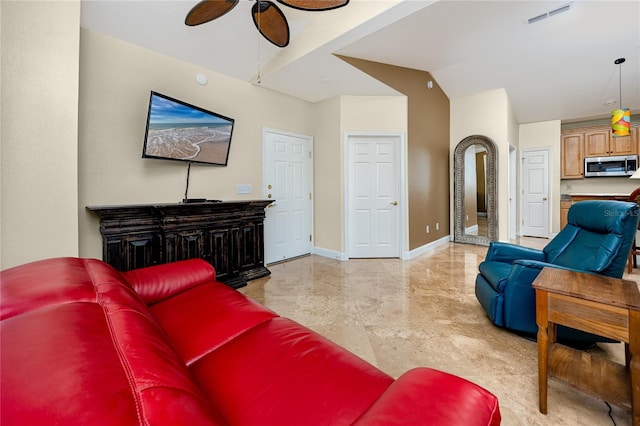 10764 70th Ave Unit 5302, Seminole, FL 33772 - living area with a ceiling fan, baseboards, light marble finish floors, and lofted ceiling