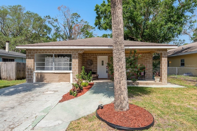 314 Bath St, Tarpon Springs, FL 34689 - ranch-style home with brick siding and roof with shingles