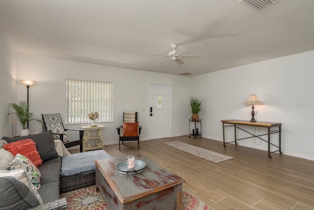 314 Bath St, Tarpon Springs, FL 34689 - living room featuring a ceiling fan, wood finished floors, and baseboards