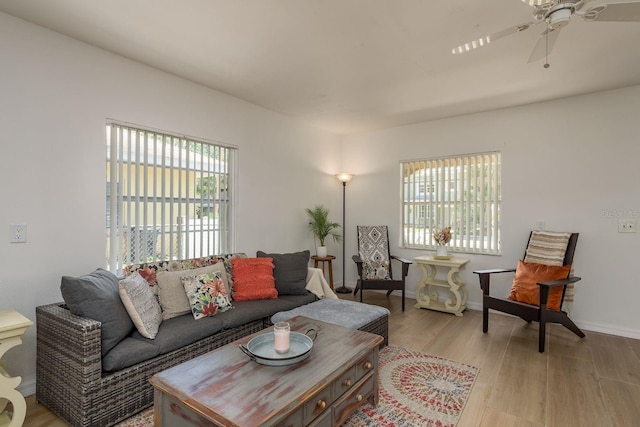314 Bath St, Tarpon Springs, FL 34689 - living room featuring ceiling fan, light wood-type flooring, and baseboards