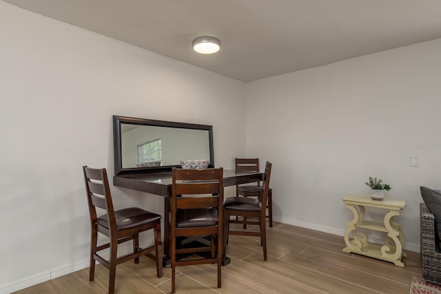 314 Bath St, Tarpon Springs, FL 34689 - dining room with wood finished floors and baseboards