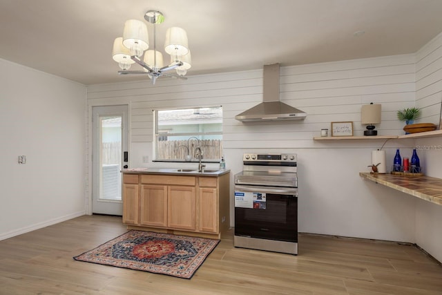 314 Bath St, Tarpon Springs, FL 34689 - kitchen with electric range, wall chimney exhaust hood, a chandelier, a sink, and light wood-style floors
