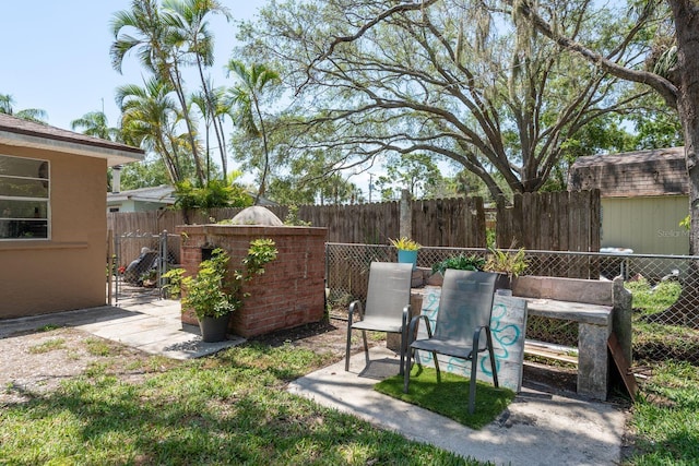 314 Bath St, Tarpon Springs, FL 34689 - fenced backyard featuring a patio
