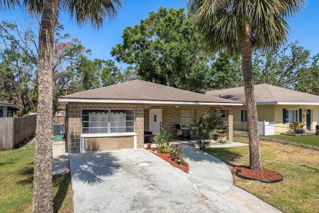 314 Bath St, Tarpon Springs, FL 34689 - single story home with central air condition unit and a shingled roof