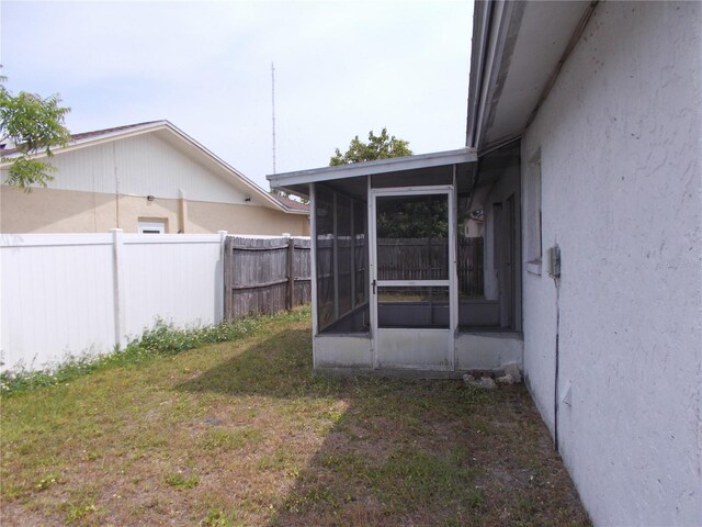 view of yard featuring a sunroom