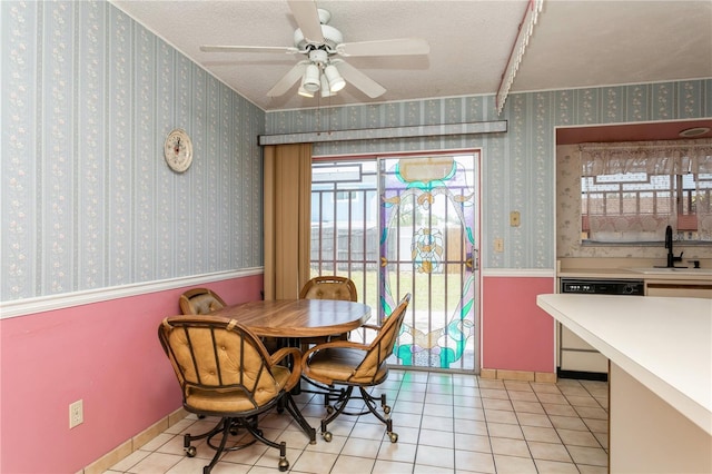 7317 W Pocahontas Ave, Tampa, FL 33634 - dining space featuring light tile patterned floors, a ceiling fan, a textured ceiling, and baseboards