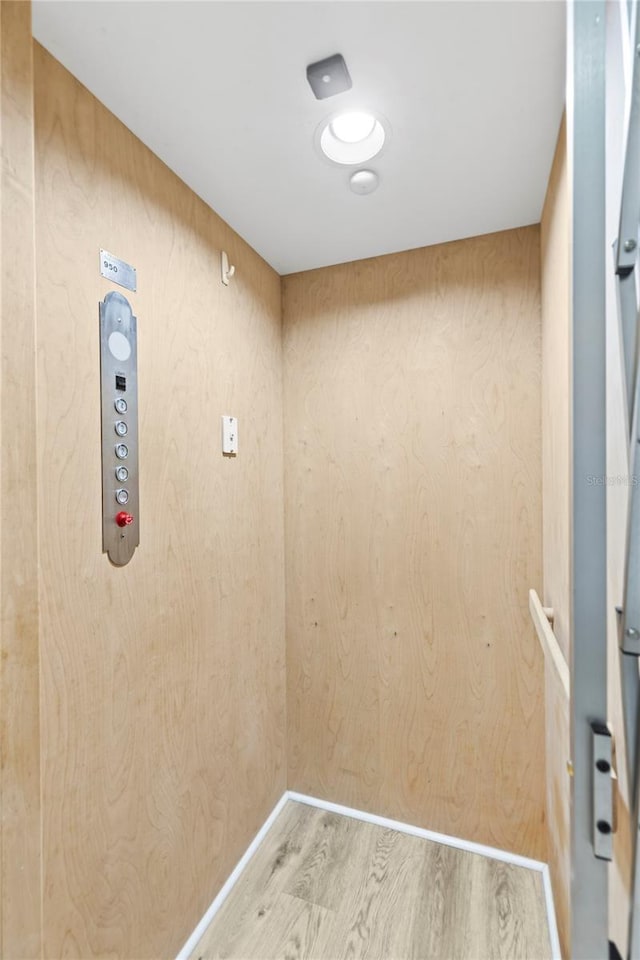 6319 Sunset Bay Cir, Apollo Beach, FL 33572 - elevator featuring wood finished floors