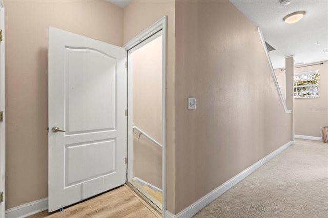 6319 Sunset Bay Cir, Apollo Beach, FL 33572 - hallway with an upstairs landing and baseboards