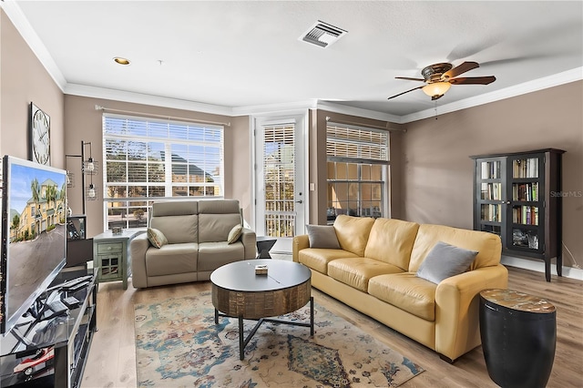 6319 Sunset Bay Cir, Apollo Beach, FL 33572 - living area with wood finished floors, ornamental molding, and a ceiling fan