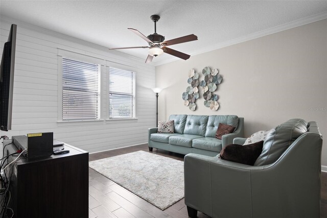 4264 Bexley Village Dr, Land O Lakes, FL 34638 - living area featuring ceiling fan, crown molding, wood finished floors, a desk, and a textured ceiling