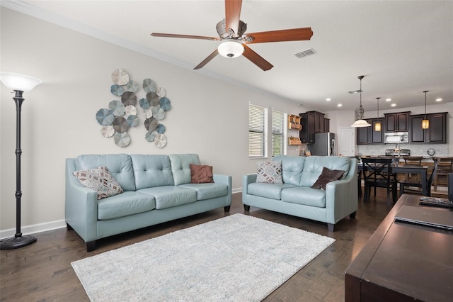 4264 Bexley Village Dr, Land O Lakes, FL 34638 - living room with ceiling fan, recessed lighting, crown molding, baseboards, and dark wood-style floors