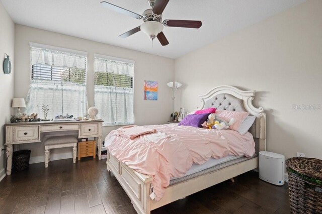 4264 Bexley Village Dr, Land O Lakes, FL 34638 - bedroom featuring dark wood-type flooring and a ceiling fan