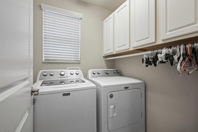 4264 Bexley Village Dr, Land O Lakes, FL 34638 - washroom with washing machine and clothes dryer and cabinet space