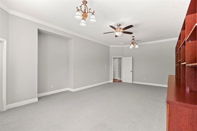 1171 Red Maple Cir NE, Saint Petersburg, FL 33703 - unfurnished living room with ornamental molding, ceiling fan, carpet flooring, baseboards, and a chandelier