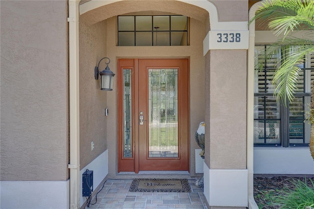 3338 Laurelwood Ct, Tarpon Springs, FL 34688 - entrance to property with stucco siding