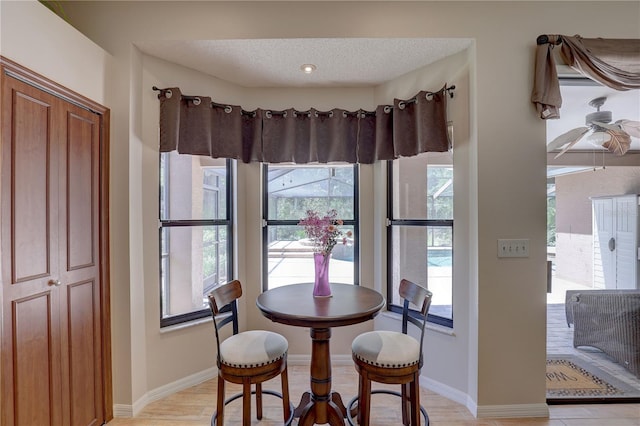 3338 Laurelwood Ct, Tarpon Springs, FL 34688 - dining area featuring plenty of natural light and baseboards