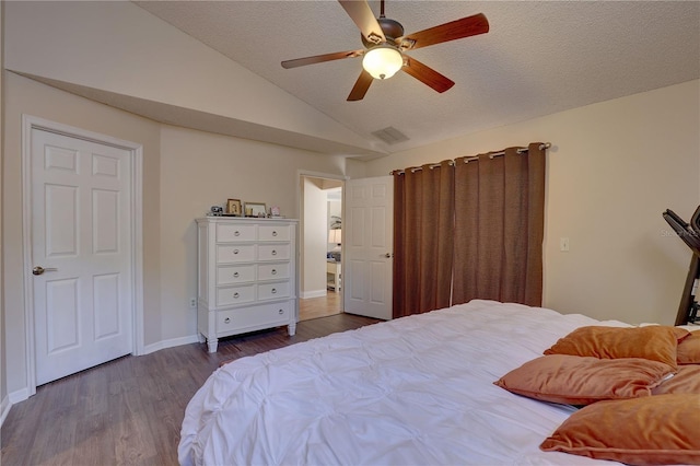 3338 Laurelwood Ct, Tarpon Springs, FL 34688 - bedroom with lofted ceiling, dark wood-type flooring, baseboards, and ceiling fan