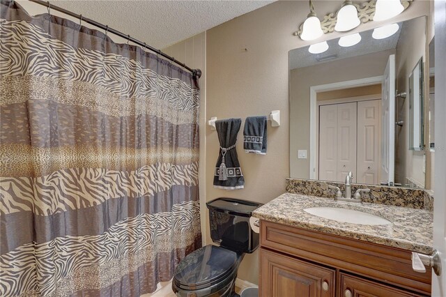 3338 Laurelwood Ct, Tarpon Springs, FL 34688 - bathroom with a textured ceiling, vanity, and curtained shower
