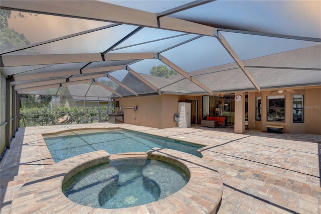 3338 Laurelwood Ct, Tarpon Springs, FL 34688 - view of pool featuring a patio, a pool with connected hot tub, and glass enclosure