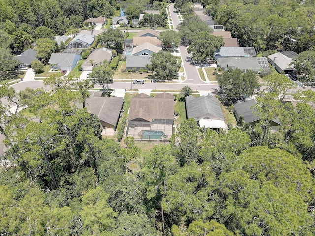 3338 Laurelwood Ct, Tarpon Springs, FL 34688 - aerial perspective of suburban area with a forest
