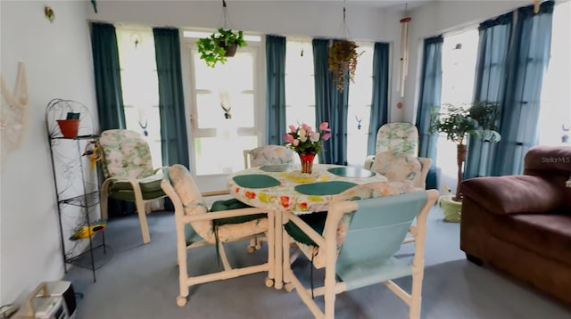 14116 Whitecap Ave, Hudson, FL 34667 - dining area featuring plenty of natural light and concrete flooring