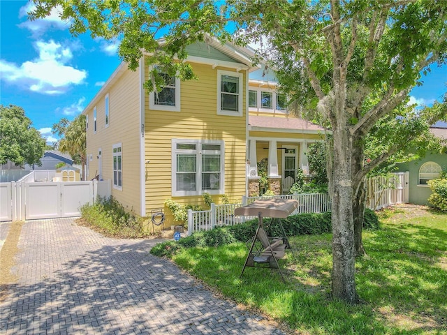 view of front of home with a gate