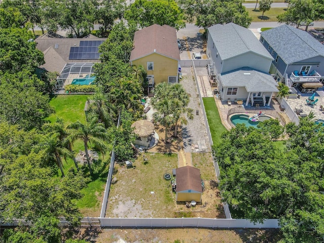 aerial perspective of suburban area featuring a pool