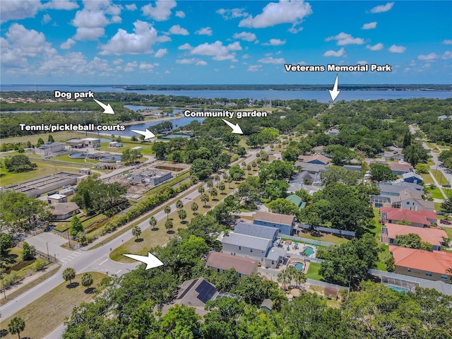 aerial perspective of suburban area featuring a nearby body of water