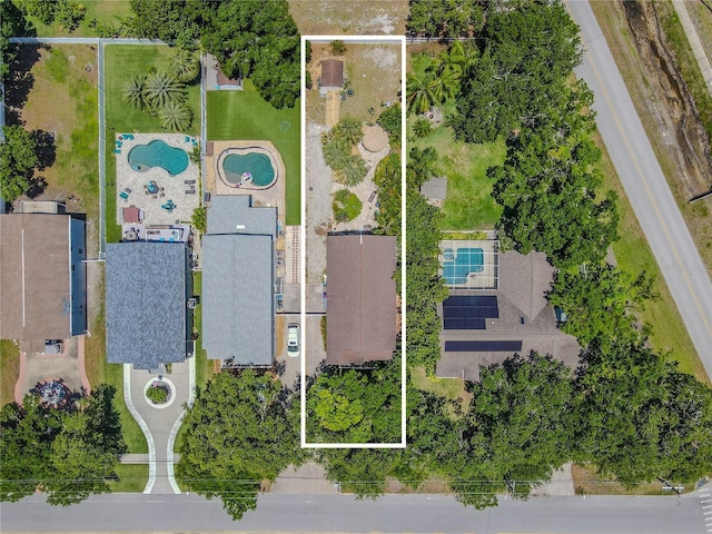 aerial overview of property's location with a pool area and property boundaries highlighted