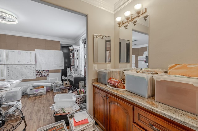 bathroom featuring ornamental molding and wood finished floors