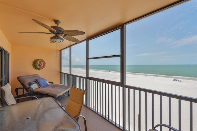 13720 Gulf Blvd Unit 302, Madeira Beach, FL 33708 - sunroom featuring ceiling fan and view of water and beach