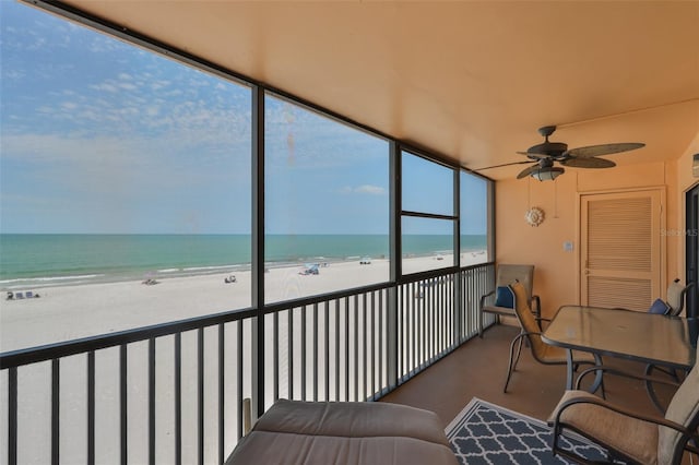13720 Gulf Blvd Unit 302, Madeira Beach, FL 33708 - sunroom / solarium with ceiling fan and view of water and beach