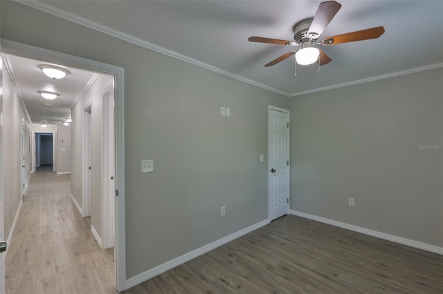 2112 33rd St SE, Ruskin, FL 33570 - unfurnished room featuring crown molding, light wood finished floors, baseboards, and a ceiling fan