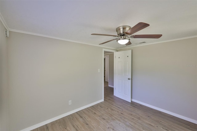 2112 33rd St SE, Ruskin, FL 33570 - unfurnished room featuring baseboards, crown molding, ceiling fan, and light wood finished floors