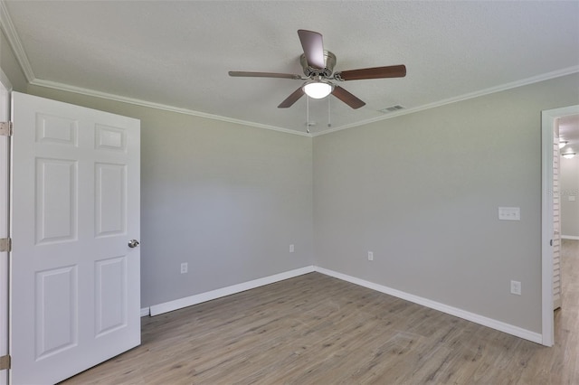 2112 33rd St SE, Ruskin, FL 33570 - empty room featuring a ceiling fan, wood finished floors, baseboards, and ornamental molding