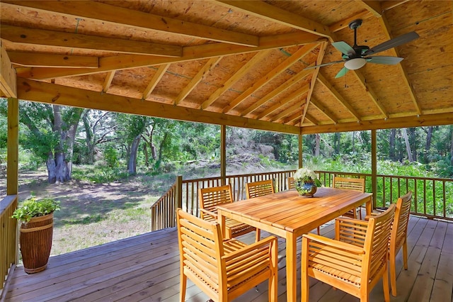 2112 33rd St SE, Ruskin, FL 33570 - wooden terrace featuring a ceiling fan, outdoor dining area, and view of scattered trees