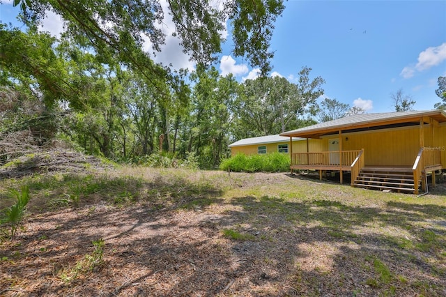 2112 33rd St SE, Ruskin, FL 33570 - view of yard featuring a deck