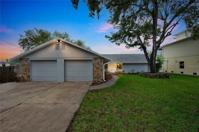 6914 Harbor Dr, Hudson, FL 34667 - view of front facade with stone siding, concrete driveway, a garage, and stucco siding