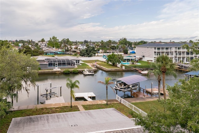 6914 Harbor Dr, Hudson, FL 34667 - water view with boat lift, a boat dock, and nearby suburban area