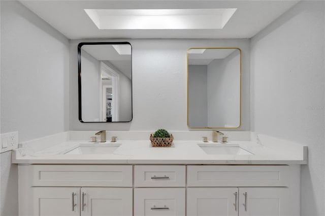 6914 Harbor Dr, Hudson, FL 34667 - bathroom with double vanity and a tray ceiling