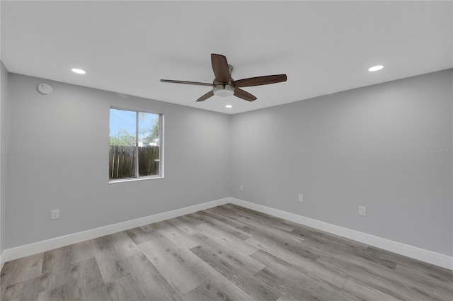6914 Harbor Dr, Hudson, FL 34667 - spare room featuring a ceiling fan, recessed lighting, wood finished floors, a smoke detector, and baseboards
