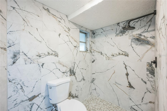 6914 Harbor Dr, Hudson, FL 34667 - bathroom featuring a textured ceiling, a marble finish shower, toilet, and tile walls
