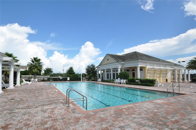 5048 Barnet Dr, Davenport, FL 33837 - community pool with a pergola and a patio area