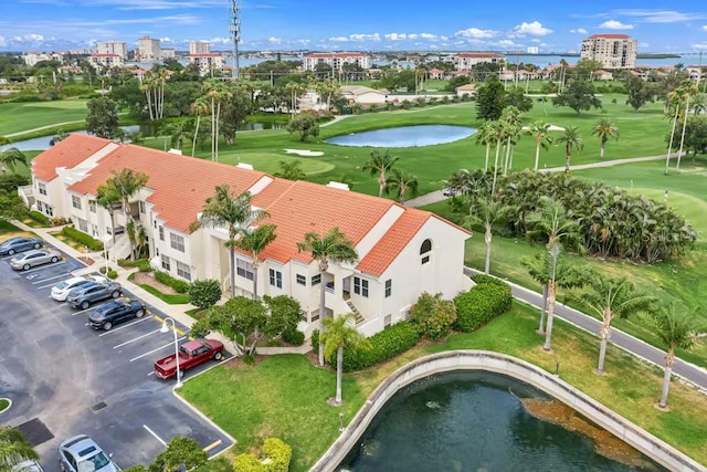 bird's eye view of a local golf course and a nearby body of water