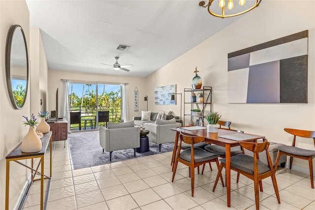 dining space featuring light tile patterned floors, a chandelier, and ceiling fan