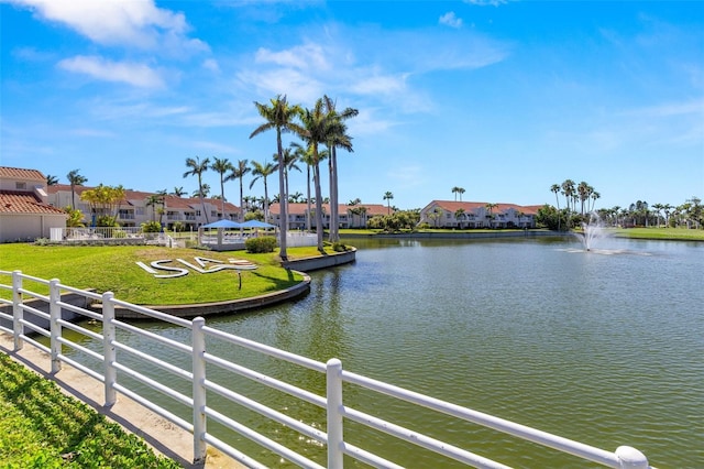water view with nearby suburban area and fence