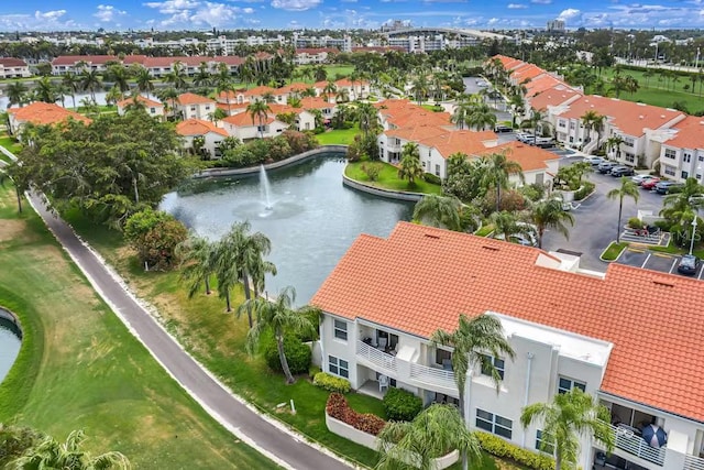 aerial view of residential area with a large body of water