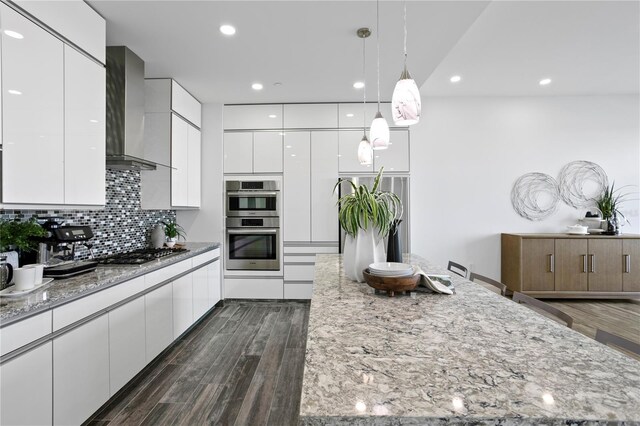 199 Dali Blvd Unit 2, Saint Petersburg, FL 33701 - kitchen with modern cabinets, wall chimney exhaust hood, white cabinets, and recessed lighting