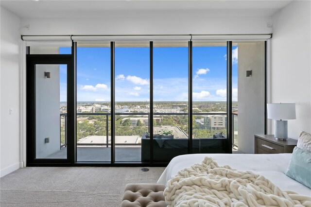 199 Dali Blvd Unit 2, Saint Petersburg, FL 33701 - bedroom with carpet floors, access to outside, and multiple windows