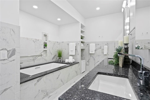 199 Dali Blvd Unit 2, Saint Petersburg, FL 33701 - full bath featuring a bath, tile walls, marble tiled flooring, recessed lighting, and double vanity